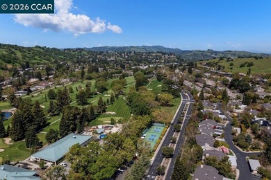 Lower level SIERRA condo in sought after lagoon entry E1 on Rossmoor Golf Course in California - for sale on GolfHomes.com, golf home, golf lot