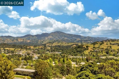 Lower level SIERRA condo in sought after lagoon entry E1 on Rossmoor Golf Course in California - for sale on GolfHomes.com, golf home, golf lot