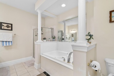 Sunlight pours into this bright, open 3-bedroom, 2-bath end-unit on Barefoot Resort and Golf Club  in South Carolina - for sale on GolfHomes.com, golf home, golf lot