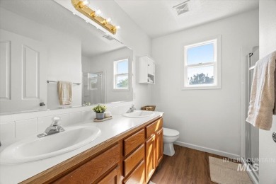 Welcome to this beautifully updated 3-bedroom, 2.5-bath home on Centennial Golf Course in Idaho - for sale on GolfHomes.com, golf home, golf lot