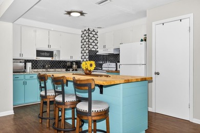 Beautifully renovated Florida cottage packed with coastal charm on Saint Josephs Bay Country Club in Florida - for sale on GolfHomes.com, golf home, golf lot