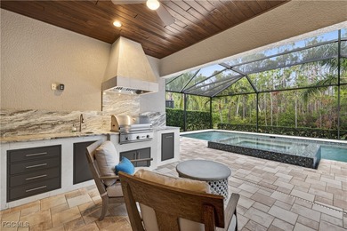 This beauty is stacked with LUXURY UPGRADES! Outdoor kitchen on The Plantation Golf and Country Club in Florida - for sale on GolfHomes.com, golf home, golf lot