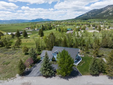 Spacious residence bordering the #7 hole at Cedar Creek Golf on  in Wyoming - for sale on GolfHomes.com, golf home, golf lot