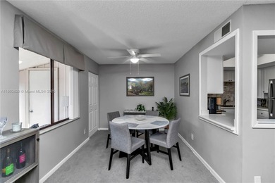 55+ COMMUNITY. GORGEOUS, TWO-BEDROOM/1.5 BATHS, SECOND-FLOOR END on Rolling Greens Executive Golf Community in Florida - for sale on GolfHomes.com, golf home, golf lot