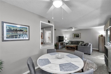 55+ COMMUNITY. GORGEOUS, TWO-BEDROOM/1.5 BATHS, SECOND-FLOOR END on Rolling Greens Executive Golf Community in Florida - for sale on GolfHomes.com, golf home, golf lot