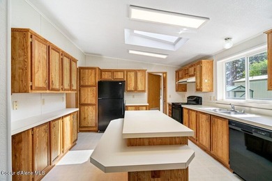 Tucked into a quiet Hayden community, this newly updated on Hayden Lake Country Club in Idaho - for sale on GolfHomes.com, golf home, golf lot