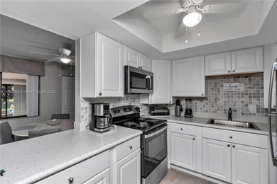 55+ COMMUNITY. GORGEOUS, TWO-BEDROOM/1.5 BATHS, SECOND-FLOOR END on Rolling Greens Executive Golf Community in Florida - for sale on GolfHomes.com, golf home, golf lot