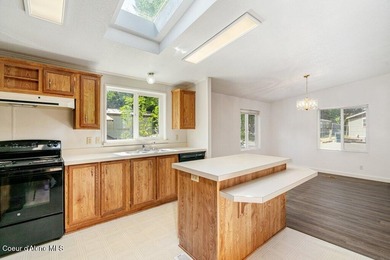 Tucked into a quiet Hayden community, this newly updated on Hayden Lake Country Club in Idaho - for sale on GolfHomes.com, golf home, golf lot