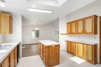 Tucked into a quiet Hayden community, this newly updated on Hayden Lake Country Club in Idaho - for sale on GolfHomes.com, golf home, golf lot