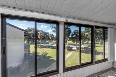 55+ COMMUNITY. GORGEOUS, TWO-BEDROOM/1.5 BATHS, SECOND-FLOOR END on Rolling Greens Executive Golf Community in Florida - for sale on GolfHomes.com, golf home, golf lot