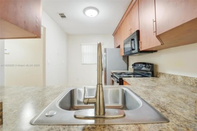 Immaculate, spacious  bright 2+/2 with extra room for use as 3rd on Woodmont Country Club in Florida - for sale on GolfHomes.com, golf home, golf lot