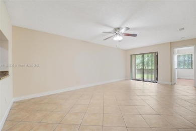 Immaculate, spacious  bright 2+/2 with extra room for use as 3rd on Woodmont Country Club in Florida - for sale on GolfHomes.com, golf home, golf lot