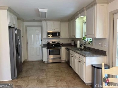 Enjoy life in this beautiful all-brick, low maintenance home in on Jennings Mill Country Club in Georgia - for sale on GolfHomes.com, golf home, golf lot