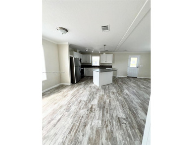 WOW! BRAND-NEW 2025 DOUBLE-WIDE MANUFACTURED HOME -- YOU OWN THE on The Club at Emerald Hills in Florida - for sale on GolfHomes.com, golf home, golf lot