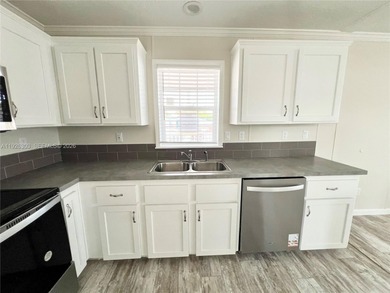 WOW! BRAND-NEW 2025 DOUBLE-WIDE MANUFACTURED HOME -- YOU OWN THE on The Club at Emerald Hills in Florida - for sale on GolfHomes.com, golf home, golf lot