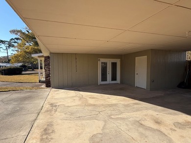 This charming home is located on a spacious 0.26-acre corner lot on  in Florida - for sale on GolfHomes.com, golf home, golf lot