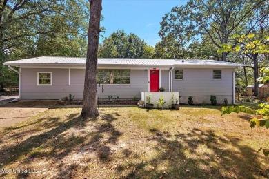 This charming 3-bedroom, 2-bath home, nestled in the heart of on Pearl Municipal Golf Course in Mississippi - for sale on GolfHomes.com, golf home, golf lot