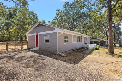 This charming 3-bedroom, 2-bath home, nestled in the heart of on Pearl Municipal Golf Course in Mississippi - for sale on GolfHomes.com, golf home, golf lot