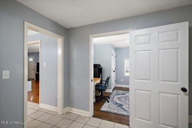 This charming 3-bedroom, 2-bath home, nestled in the heart of on Pearl Municipal Golf Course in Mississippi - for sale on GolfHomes.com, golf home, golf lot