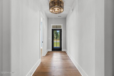 Stunning new construction in the desirable and gated community on Carolina National Golf Club in North Carolina - for sale on GolfHomes.com, golf home, golf lot