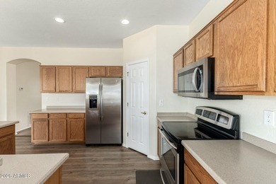 Stunning two-story residence with manicured landscape and 3-car on Southern Ridge Golf Club in Arizona - for sale on GolfHomes.com, golf home, golf lot