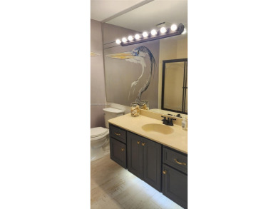 This stunning Mediterranean/Spanish-style home embodies elegance on Bear Lakes Country Club in Florida - for sale on GolfHomes.com, golf home, golf lot