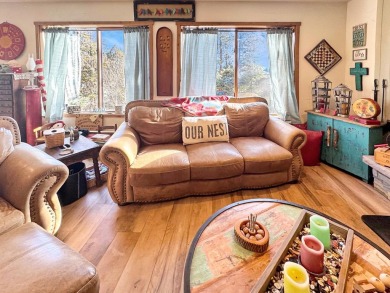 If you are looking for a mountain getaway, this charming on Angel Fire Resort Country Club in New Mexico - for sale on GolfHomes.com, golf home, golf lot