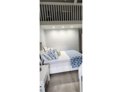 This stunning Mediterranean/Spanish-style home embodies elegance on Bear Lakes Country Club in Florida - for sale on GolfHomes.com, golf home, golf lot