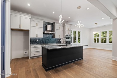 Stunning new construction in the desirable and gated community on Carolina National Golf Club in North Carolina - for sale on GolfHomes.com, golf home, golf lot