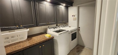 This stunning Mediterranean/Spanish-style home embodies elegance on Bear Lakes Country Club in Florida - for sale on GolfHomes.com, golf home, golf lot