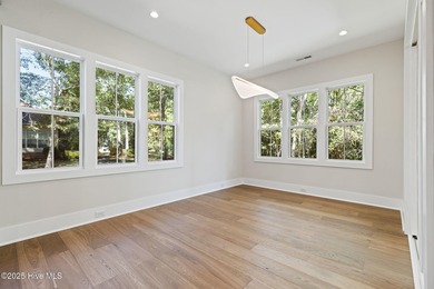 Stunning new construction in the desirable and gated community on Carolina National Golf Club in North Carolina - for sale on GolfHomes.com, golf home, golf lot