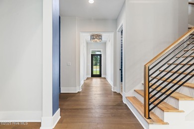 Stunning new construction in the desirable and gated community on Carolina National Golf Club in North Carolina - for sale on GolfHomes.com, golf home, golf lot