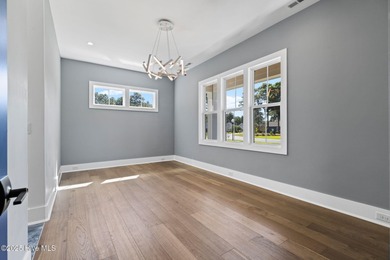 Stunning new construction in the desirable and gated community on Carolina National Golf Club in North Carolina - for sale on GolfHomes.com, golf home, golf lot