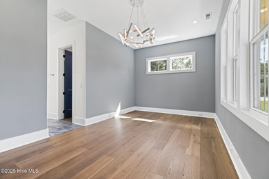 Stunning new construction in the desirable and gated community on Carolina National Golf Club in North Carolina - for sale on GolfHomes.com, golf home, golf lot