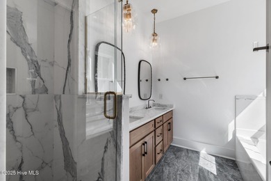 Stunning new construction in the desirable and gated community on Carolina National Golf Club in North Carolina - for sale on GolfHomes.com, golf home, golf lot