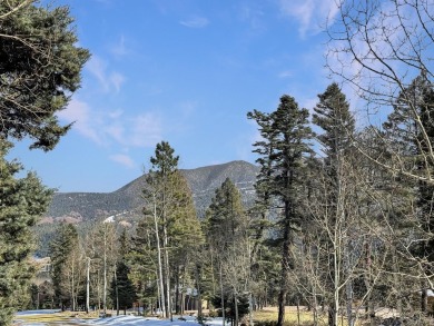 If you are looking for a mountain getaway, this charming on Angel Fire Resort Country Club in New Mexico - for sale on GolfHomes.com, golf home, golf lot