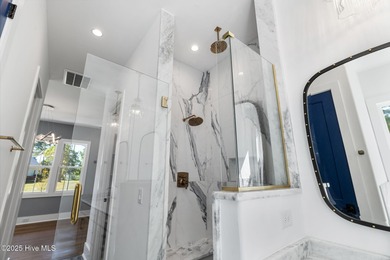 Stunning new construction in the desirable and gated community on Carolina National Golf Club in North Carolina - for sale on GolfHomes.com, golf home, golf lot