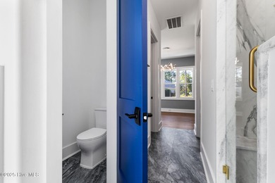 Stunning new construction in the desirable and gated community on Carolina National Golf Club in North Carolina - for sale on GolfHomes.com, golf home, golf lot