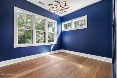 Stunning new construction in the desirable and gated community on Carolina National Golf Club in North Carolina - for sale on GolfHomes.com, golf home, golf lot