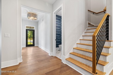 Stunning new construction in the desirable and gated community on Carolina National Golf Club in North Carolina - for sale on GolfHomes.com, golf home, golf lot