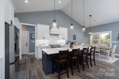 Fabulous golf course home featuring impressive vaulted ceiling on Woodbridge Golf Links in North Carolina - for sale on GolfHomes.com, golf home, golf lot