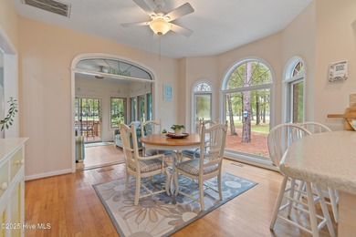 This beautiful home, across from a pretty pond, is located along on Lockwood Folly Country Club in North Carolina - for sale on GolfHomes.com, golf home, golf lot