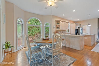 This beautiful home, across from a pretty pond, is located along on Lockwood Folly Country Club in North Carolina - for sale on GolfHomes.com, golf home, golf lot