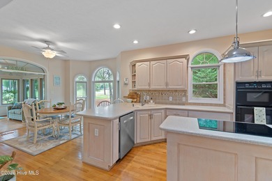 This beautiful home, across from a pretty pond, is located along on Lockwood Folly Country Club in North Carolina - for sale on GolfHomes.com, golf home, golf lot