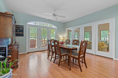 This beautiful home, across from a pretty pond, is located along on Lockwood Folly Country Club in North Carolina - for sale on GolfHomes.com, golf home, golf lot