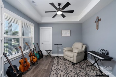 Fabulous golf course home featuring impressive vaulted ceiling on Woodbridge Golf Links in North Carolina - for sale on GolfHomes.com, golf home, golf lot
