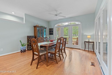 This beautiful home, across from a pretty pond, is located along on Lockwood Folly Country Club in North Carolina - for sale on GolfHomes.com, golf home, golf lot