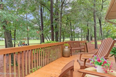 This beautiful home, across from a pretty pond, is located along on Lockwood Folly Country Club in North Carolina - for sale on GolfHomes.com, golf home, golf lot