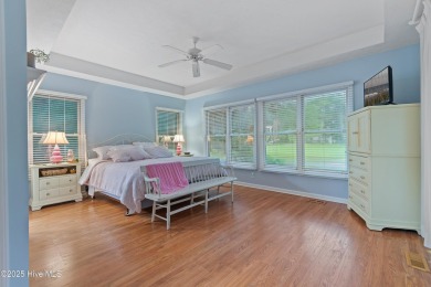 This beautiful home, across from a pretty pond, is located along on Lockwood Folly Country Club in North Carolina - for sale on GolfHomes.com, golf home, golf lot