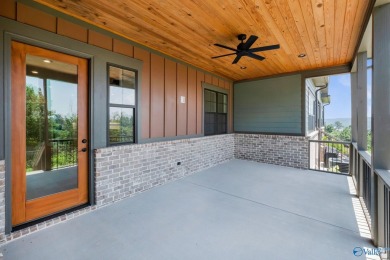 Located in Gunter's Landing Golf Club, this lake view villa on Gunters Landing in Alabama - for sale on GolfHomes.com, golf home, golf lot